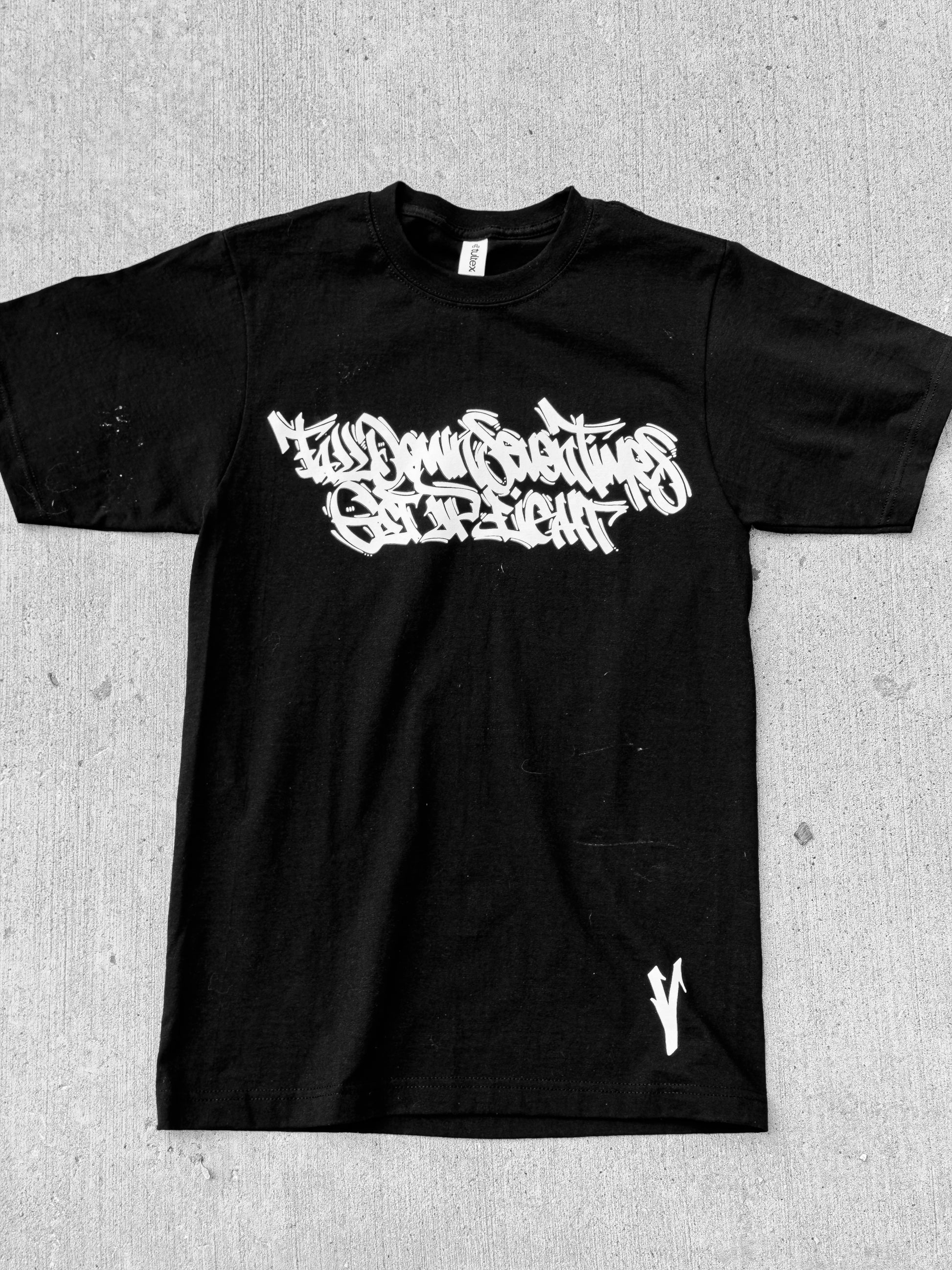 Fitted for vendetta rock bottom tee - fall down seven times get up eight - heavyweight black tee on concrete 